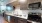 a kitchen with a stove and microwave